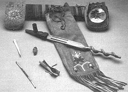 Elements for a Pipe Ceremony: the sacred pipe, carrying pouch, medicine hundles, tobacco role