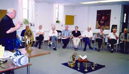J.W. Windland of the Encounter World Religions Centre in Guelph displays and explains sacred objects from the world¹s religions to Scarboro priest and lay missioners. Toronto.