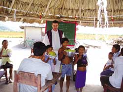 Offertory of local products by children of the community, as Fr. Ron MacDonell celebrates Mass in Japó village. Brazil. Photo Credit: Bev Trach