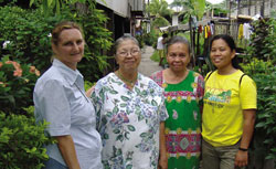 Inday and Patring welcome Sr. Christine Gebel (left) and Sr. Anie Montejo (far right) to a meeting of their Basic Christian Community in the village of Bitanag.