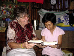 Dading helps Sr. Mary Gauthier study Cebuano.