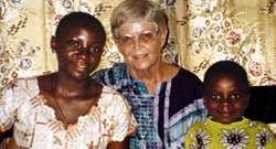 Sr. Suzanne Marshall with two special friends-Nancy and her little brother Aondosoo whose name means 'God loves'. Since their mother's death, Nancy is raising her brother who is HIV positive, and both are attending school. Sr. Suzanne accompanies people living with HIV/AIDS in Vandeikya, Nigeria.