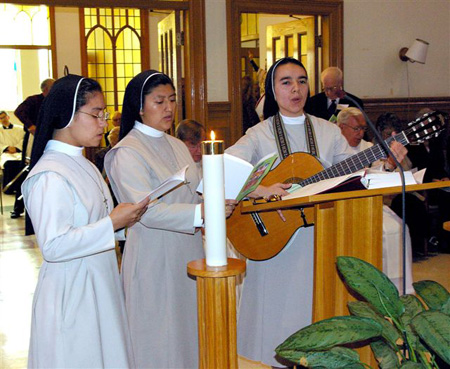 The Psalms were sung by Missionary Sisters of St. Theresa of Columbia, led by Sr. Claudia Llanos with guitar