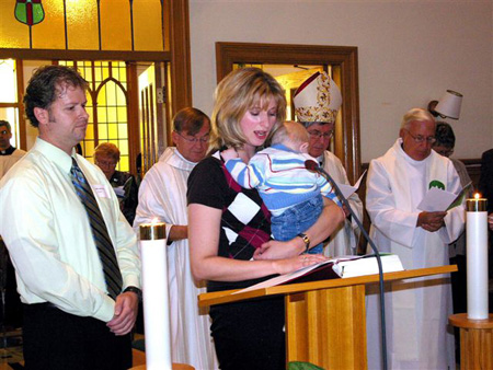 Prayers of the Faithful read by former Lay Missioners Marc Chartrand and Anne Quesnelle with their baby boy
