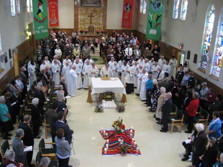 Overhead view of overflowing chapel from balcony