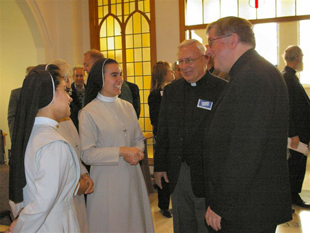 Archbishop Collins and Fr. Lynch talking to the Teresitas Sisters