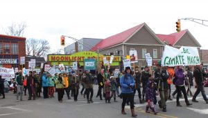 In Antigonish, Nova Scotia, people taking part in the global climate march of November 28, 2015, as part of the town’s Santa Claus parade.