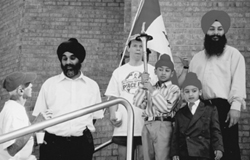 A Sikh youth holds the peace torch as members of Gursikh Sabha Gurdwara, a Sikh temple in Scarborough, Ontario, welcome the peace runners to the temple.