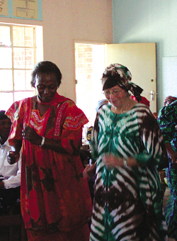 Malawians love to dance and they share this joy with all who are willing to learn. A few local women give lay missioner Betty Ann Martin her first lesson.