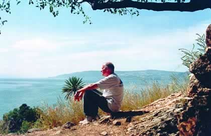 Fr. John Carten sits at a hillside cave overlooking the Sea of Galilee. After a sabbatical in the Holy Land in 2001, Fr. John returned to Canada and was elected to leadership as a member of the General Council. He is also responsible for Scarboro's Mission Information Department.