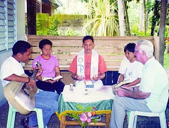 Fr. Pat Kelly (far right) celebrating Eucharist in Zamboanga Del Norte, Mindanao, with parish priest Fr. Atilano (Ati) Tabaraza, Michael, Mila and Lorraine. All are members of the follow-up team of the Redemptorist mission involved in developing lay leadership in Basic Christian Communities.