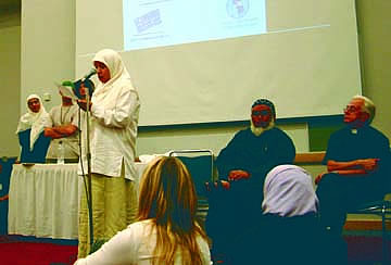 A Muslim youth speaker at the World Youth Day interfaith event in Toronto, co-sponsored by Scarboro Missions and the Toronto Muslim community. Seated to her left are Abdul Patel, an imam (spiritual leader) within the Muslim community, and Scarboro missioner Fr. Ray O¹Toole.
