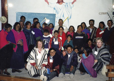 Visiting missioners (front row, L-R) Yvonne Olofsson from Sweden; Tobias Guaman, deacon and yanapac (program leader); and Scarboro missioner Micheline Karvonen (far right) with the mountain community of Gatazo Chico in the diocese of Riobamba.
