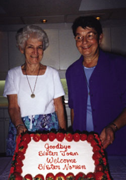 At Maryglen, Our Lady's Missionaries' place of affordable housing for women in downtown Toronto, residents host a celebration welcoming Sr. Noreen Kearns (left), the new directress, even as they bid farewell to Sr. Joan Missiaen (right).