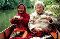 Good Shepherd Sister Rosario Battung, a teacher of Zen meditation, picnics with Sr. Elaine MacInnes on the Isis River in Oxford, England. Sr. Elaine served as Executive Director of the Prison Phoenix Trust, an organization in the U.K. that helps prisoners through yoga and meditation to use their cells as places of spiritual retreat.