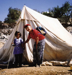 After her home in the West Bank was destroyed by war, this little girl and her family now have temporary shelter in a tent. She was leaving for school when Our Lady's Missionary Sr. Mae Janet MacDonell visited her. Sr. Mae Janet spent two weeks in the West Bank city of Hebron last September. She was there on a visit of solidarity organized by Christian Peacemaker Teams, which places trained peacemakers in situations of conflict around the world to defuse tension and witness to peace.