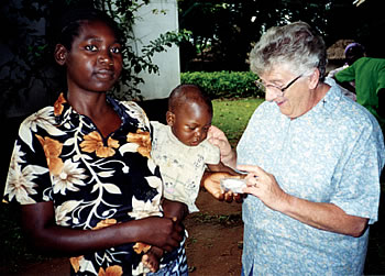 Sr. Mary Deighan enjoys the company of this little one whose mother belongs to an HIV/AIDS support group.