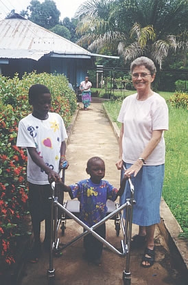 Sr. Rosemarie Donovan with a young patient at a physiotherapy centre. Sr. Rosemarie runs a program for the physically disabled. Her goal is to help them become respected members in their communities, and to increase their mobility through such measures as corrective surgery and physiotherapy; by providing walkers, crutches and wheelchairs; and by providing assistance for schooling and apprenticeships.