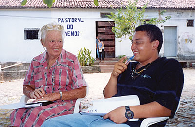 Sr. Mona Kelly at an outdoor meeting with Aurelio, a former street kid who is now a pastoral educator working with boys who live on the streets of Fortaleza, Brazil.