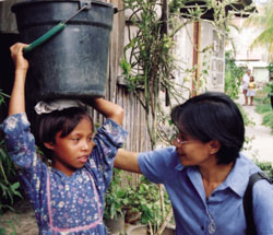 Sr. Lalang Nunez enjoys the company of little ones in their community of cagayan de Oro, Philippines