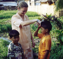 Placing Sr. Christine's hand to his forehead, this little boy says 'Amen' in the Philippine tradition of children asking for and receiving a blessing from adults.