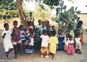 Children and their teacher at the nursery school in Karonga, a program of the Lusubiro Community-Based Orphan Care Project.