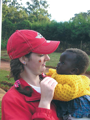 Little Fels and Stephanie share a moment of love and friendship. Mzuzu, Malawi.