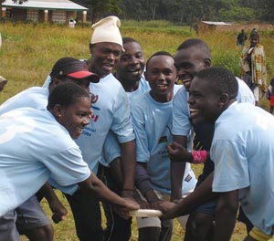 The blue team's cheer before the Frisbee game begins. Malawi. The blue team's cheer before the Frisbee game begins. Malawi.
