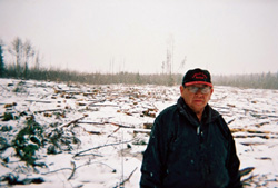 Lubicon elder Reinie Jobin in front of an area clearcut by Deep Well Oil and Gas in Lubicon Territory. Credit: Kevin Thomas/Friends of the Lubicon