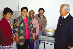 With the volunteers is Scarboro missioner Julia Duarte, to the right of Bishop Corral.