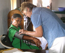 HEALTH CARE: Barbara White, a registered nurse, accompanies the people in the village of Ashialton in Guyana's interior.