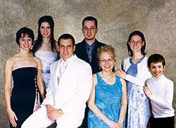 Linda Dziadyk and her children at her son Joe's Grade 12 graduation. L-R: Catherine, Anna and Joe (seated), John, Maria, and Stephen.