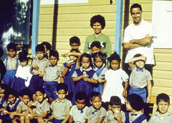 Fr. Art MacKinnon with a group of school children and their teacher. Dominican Republic. 1963.