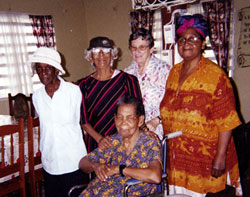 Olive Seely, Mrs. Mohalui, Joan Fredericks and Doris Williams, residents of the Good Samaritan Home for women, welcome Sr. Cecile Turner, a regular visitor. New Amsterdam, Guyana.