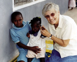Little Iveren (centre) gets special attention from Sr. Rosemary Williamson. Sr. Rosemary works in pastoral care, the formation of lay leadership, and with women's groups. She also participates in a social justice group with young people who are looking at human rights issues and providing a ministry to prisoners.
