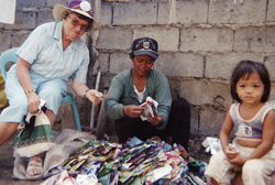 Sr. Mary Gauthier with a local vendor and her daughter. Cagayan de Oro, Philippines.
