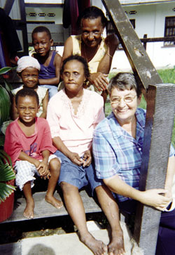 Loretta Dover, her grandchildren, and her daughter who is blind, welcome Sr. Joan Missiaen for a home visit. New Amsterdam, Guyana.