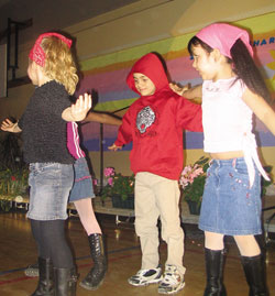 R-L: Carly Russell and Tyler Samms (Grade Two) with classmates performing for the talent show.