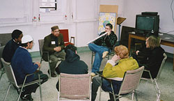 Iman Muhammud Atieque and Ryan Nutter (both facing camera) with Muslim and Christian youth in dialogue at the Scarboro Mission Centre in Toronto. Ryan is doing his high school co-operative education with Scarboro Missions, assisting with interfaith retreats and other initiatives.