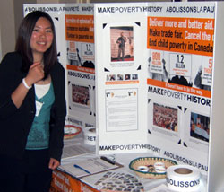 Trixie Ling stands beside an eye-catching display that she created to promote the Make Poverty History campaign.