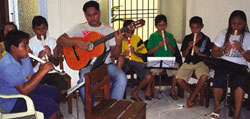 Saturday morning music lessons for street kids, one of the programs at the Association Dom Jorge. Itacoatiara, Brazil.