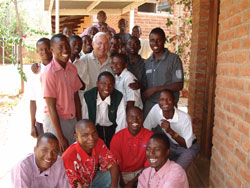 During a trip to Malawi in 2006, Fr. Jack Lynch, Superior General of Scarboro Missions, visits with young men in their first year of formation for the priesthood at Christ the King Formation Centre in Rumphi, Malawi.