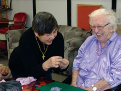 Lorraine Steele gets a little instruction from Sr. Lucia Lee during the jewelry-making class at Harmony Hall Centre for Seniors, Toronto