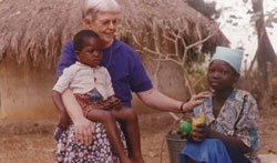 Sr. Suzanne Marshall visits young friends in their compound. Sr. Suzanne continues to be involved with orphans and with programs for vulnerable children, helping them with computer training, clothing, food supplements and medical care. Vandeikya, Nigeria