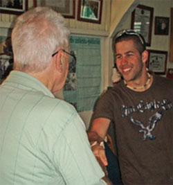 St. Mary's student Matt Kavanaugh meets Fr. Lou Quinn when the group arrives in Ocoa to participate in the 2007 D.R.E.A.M.S. project. Fr. Lou met with the students three times during their week-long stay.