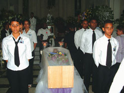 These youth were among several group representatives who took turns as honorary pallbearers attending the coffin during the wake while thousands of people streamed by to pay their respects.