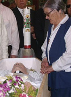 Sr. Mary Jo Mazzerolle of the Religious Hospitallers of St. Joseph at Fr. Lou Quinn's wake. Sr. Mary Jo has been in San José de Ocoa since 1965 and has administered the Padre Arturo Centre in town. The Centre has an elementary school as well as vocational and technical training facilities and is named after Scarboro missioner Fr. Art MacKinnon who was martyred in the Dominican Republic. The community of Religious Hospitallers in Ocoa have for many years served the community in the areas of health care and education.