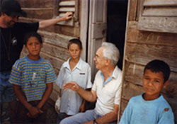 Above: Children of a campo (mountain village) enjoy being visited by Fr. Lou Quinn and St. Joseph Catholic High School teacher Jim Lacey. San José de Ocoa. 1997.