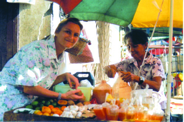 Sr. Christine Gebel shopping at her friend Dading’s market stall. Cagayan de Oro, Philippines.