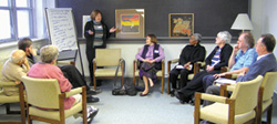 The more than 60 participants gathered for small group discussions during the session, 'My vision of a world without hatred', at the Scarboro Mission Centre. 